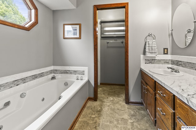 13952 Frederick Cir, Omaha, NE 68138 - full bath with vanity, a jetted tub, and baseboards