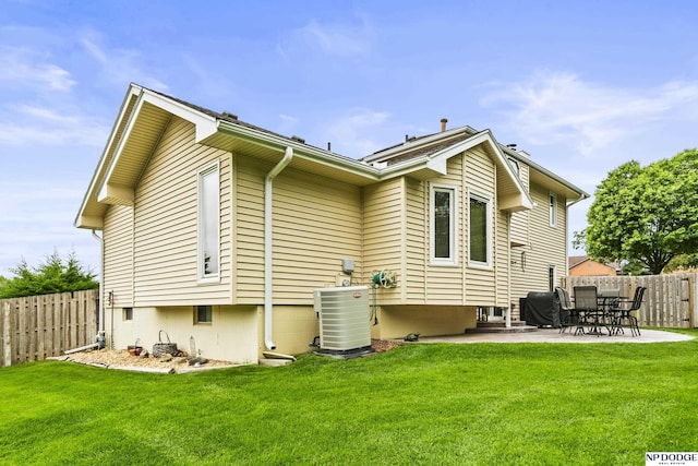 13952 Frederick Cir, Omaha, NE 68138 - back of property with a patio and central AC