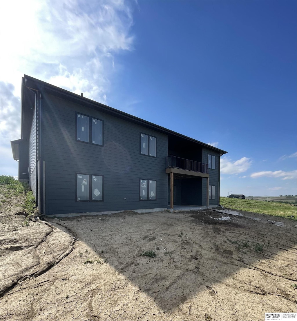 10915 N 161st Ave, Bennington, NE 68007 - back of house featuring a balcony and a patio area
