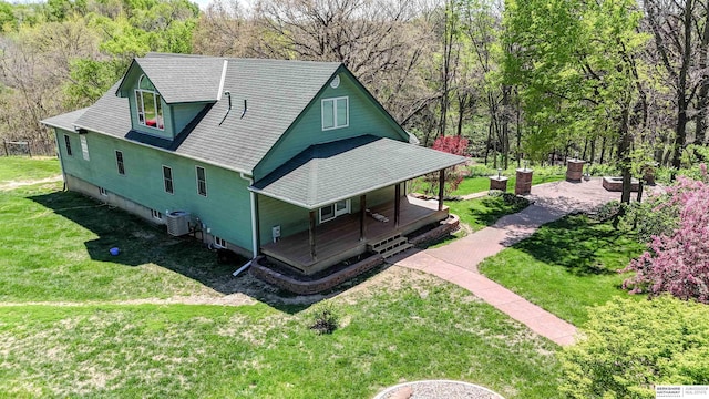 5531 County Road 34, Fort Calhoun, NE 68023 - view of side of property featuring covered porch, a yard, and central air condition unit