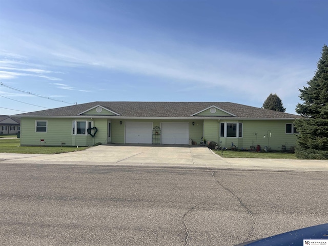 901 E 9th St, Valentine, NE 69201 - ranch-style home with an attached garage, concrete driveway, and roof with shingles