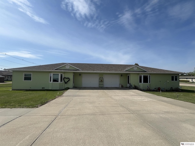 901 E 9th St, Valentine, NE 69201 - ranch-style home featuring an attached garage, a front lawn, concrete driveway, and a shingled roof