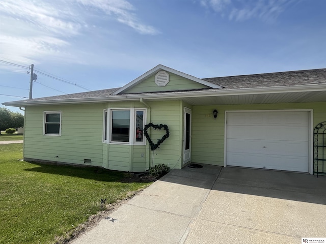 901 E 9th St, Valentine, NE 69201 - view of front of house featuring a garage, a front yard, roof with shingles, and concrete driveway