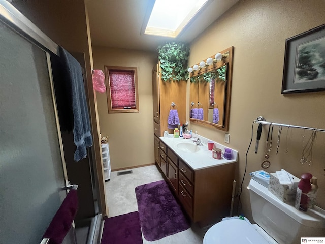 901 E 9th St, Valentine, NE 69201 - bathroom featuring vanity, toilet, and a stall shower