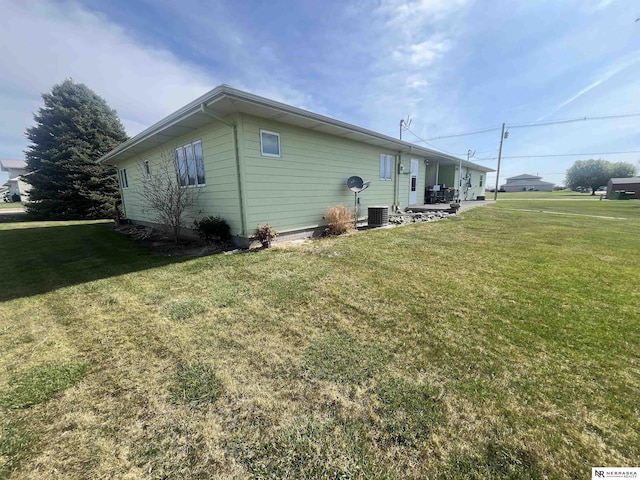 901 E 9th St, Valentine, NE 69201 - view of home's exterior with a yard and cooling unit