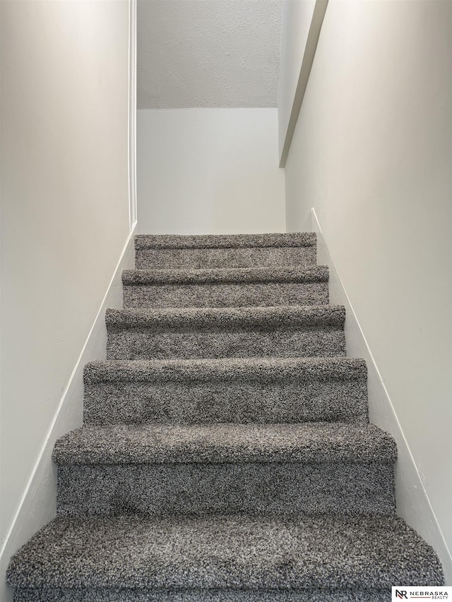 914 S 26th St, Omaha, NE 68105 - stairway with a textured ceiling