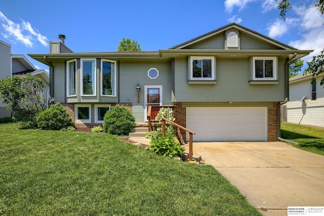 14014 S 35th St, Bellevue, NE 68123 - split foyer home featuring brick siding, an attached garage, a front yard, a chimney, and driveway