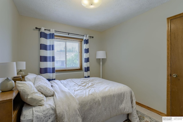 14014 S 35th St, Bellevue, NE 68123 - bedroom with a textured ceiling and baseboards