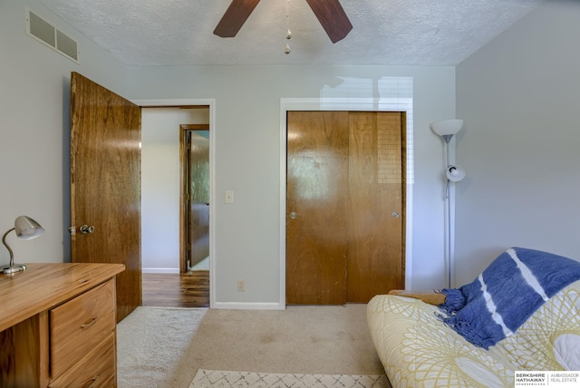 14014 S 35th St, Bellevue, NE 68123 - sitting room featuring carpet floors, a textured ceiling, baseboards, and a ceiling fan