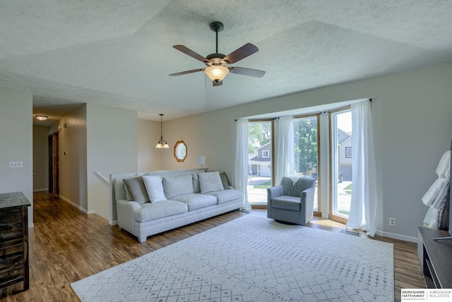 14014 S 35th St, Bellevue, NE 68123 - living area featuring a textured ceiling, ceiling fan, wood finished floors, baseboards, and a chandelier