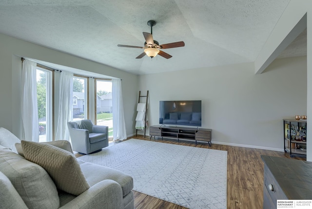 14014 S 35th St, Bellevue, NE 68123 - living room featuring a textured ceiling, ceiling fan, baseboards, and dark wood-type flooring