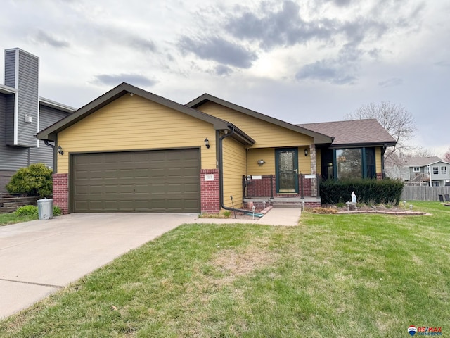 1507 SW 13th St, Lincoln, NE 68522 - view of front of house with brick siding, an attached garage, a front yard, and driveway