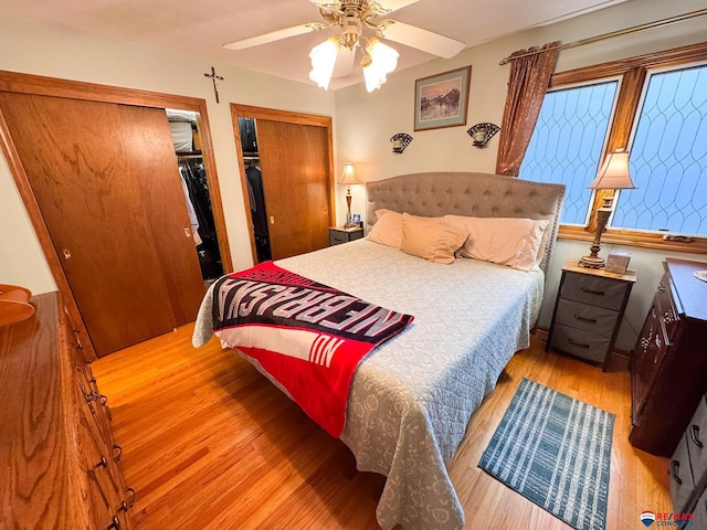 1507 SW 13th St, Lincoln, NE 68522 - bedroom with wood finished floors, two closets, and a ceiling fan