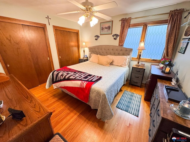 1507 SW 13th St, Lincoln, NE 68522 - bedroom with light wood-type flooring, multiple closets, and ceiling fan