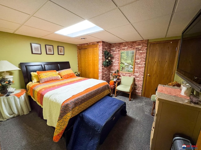 1507 SW 13th St, Lincoln, NE 68522 - carpeted bedroom with a paneled ceiling and brick wall