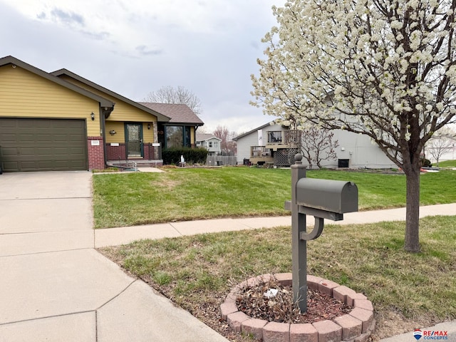 1507 SW 13th St, Lincoln, NE 68522 - view of front of property featuring a garage, a front lawn, driveway, and brick siding