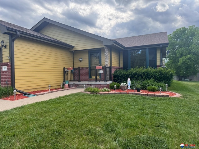 1507 SW 13th St, Lincoln, NE 68522 - view of front of home featuring a front lawn and brick siding