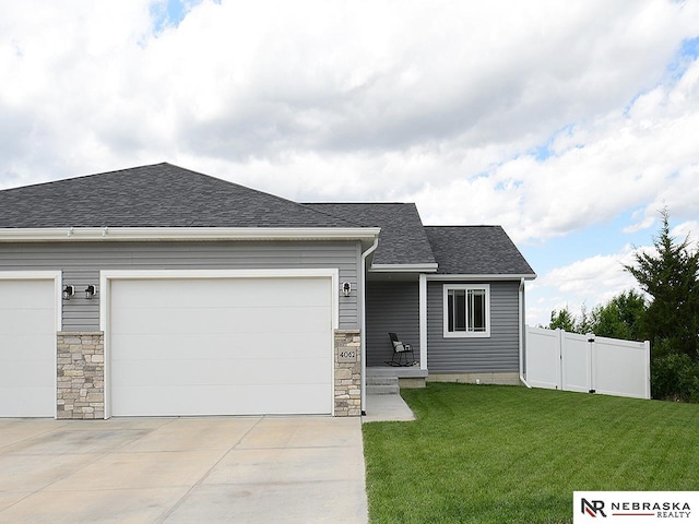 4062 W Gary Gately St, Lincoln, NE 68528 - view of front of house with concrete driveway, roof with shingles, and a garage