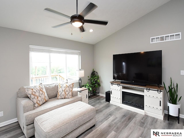 4062 W Gary Gately St, Lincoln, NE 68528 - living room featuring a ceiling fan, baseboards, wood finished floors, lofted ceiling, and recessed lighting