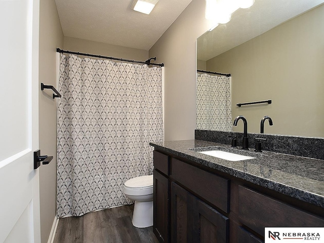 4062 W Gary Gately St, Lincoln, NE 68528 - full bath with toilet, wood finished floors, and vanity