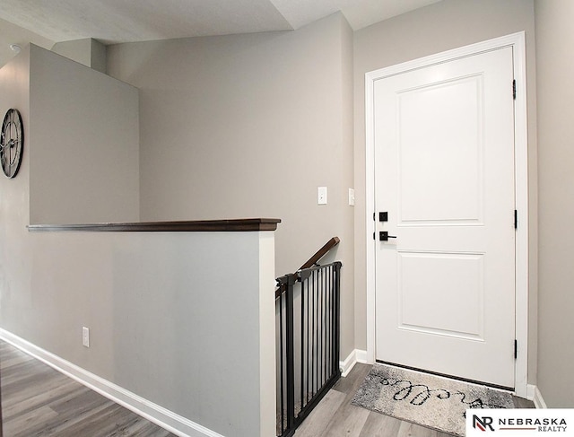 4062 W Gary Gately St, Lincoln, NE 68528 - corridor with wood finished floors, baseboards, and an upstairs landing