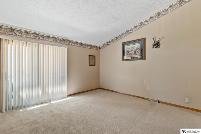 5082 S 149th Ct, Omaha, NE 68137 - empty room featuring a textured ceiling, vaulted ceiling, carpet, healthy amount of natural light, and baseboards