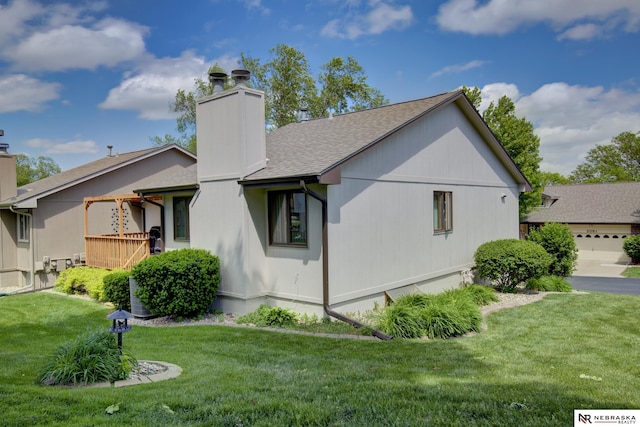 5082 S 149th Ct, Omaha, NE 68137 - view of side of property with a chimney, a yard, and roof with shingles