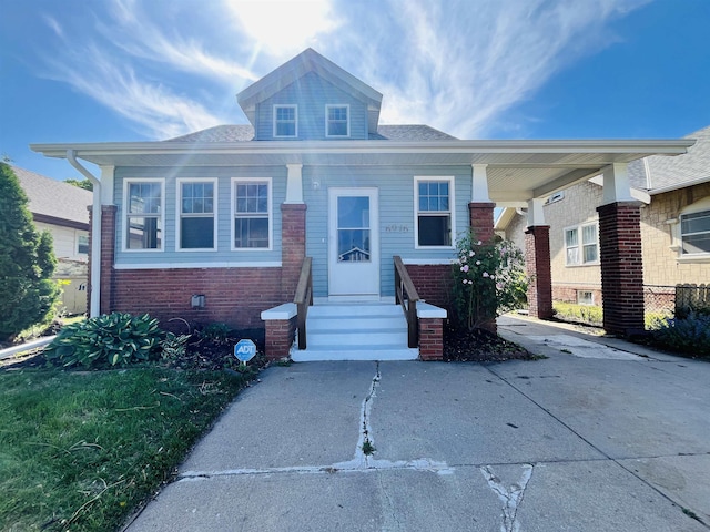 6916 N 24th St, Omaha, NE 68112 - bungalow-style home featuring entry steps and brick siding