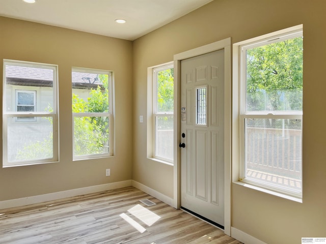 6916 N 24th St, Omaha, NE 68112 - foyer entrance featuring light wood-style floors, baseboards, and recessed lighting