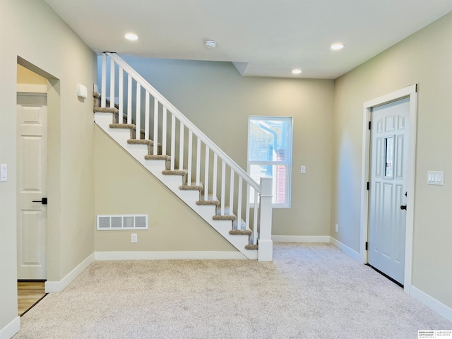 6916 N 24th St, Omaha, NE 68112 - entryway with carpet flooring, stairway, recessed lighting, and baseboards