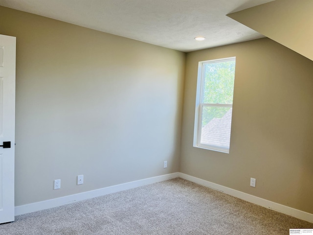 6916 N 24th St, Omaha, NE 68112 - carpeted spare room featuring baseboards and recessed lighting
