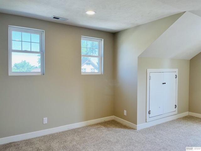 6916 N 24th St, Omaha, NE 68112 - bonus room with baseboards, light carpet, and recessed lighting
