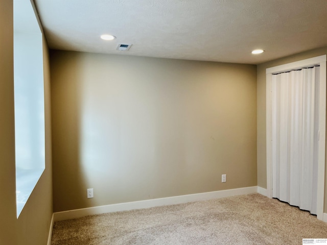 6916 N 24th St, Omaha, NE 68112 - unfurnished room featuring light colored carpet, recessed lighting, and baseboards