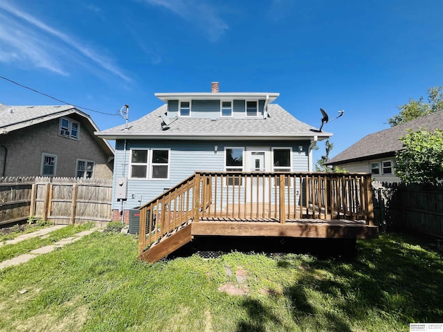 6916 N 24th St, Omaha, NE 68112 - rear view of house featuring a wooden deck, a chimney, and roof with shingles