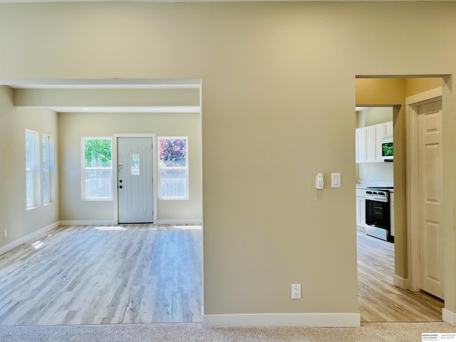 6916 N 24th St, Omaha, NE 68112 - entryway featuring baseboards and light wood-type flooring