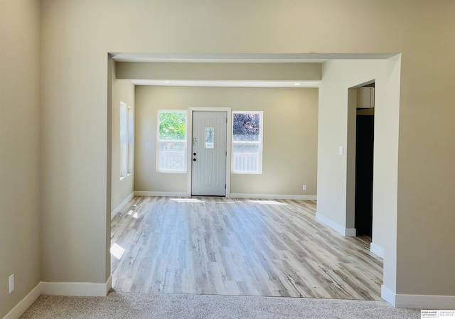 6916 N 24th St, Omaha, NE 68112 - entryway with baseboards and wood finished floors
