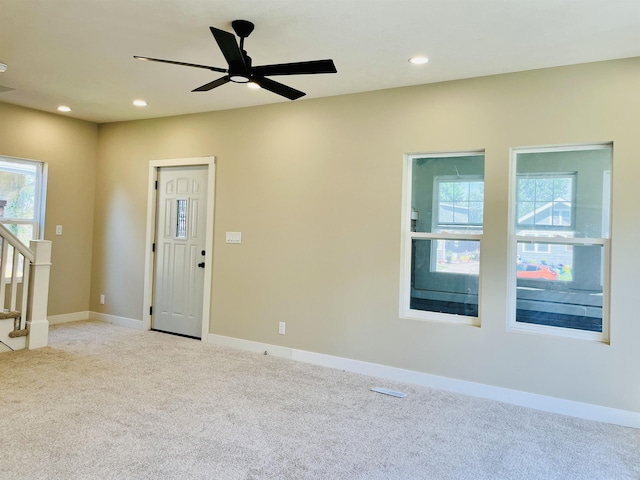 6916 N 24th St, Omaha, NE 68112 - carpeted empty room with ceiling fan, recessed lighting, stairs, and baseboards