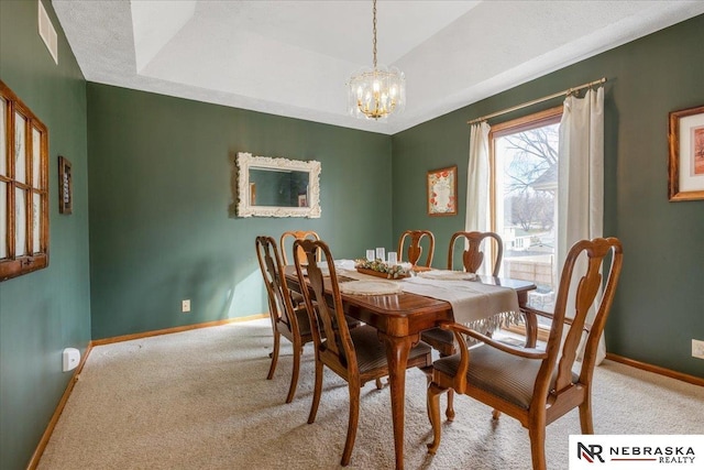 926 Iron Rd, Papillion, NE 68046 - carpeted dining area with baseboards and a chandelier