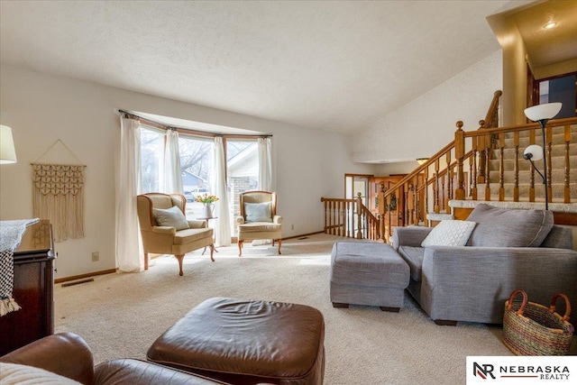 926 Iron Rd, Papillion, NE 68046 - carpeted living room featuring baseboards, stairs, and vaulted ceiling