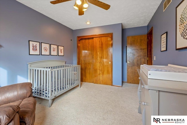 926 Iron Rd, Papillion, NE 68046 - bedroom with carpet, a textured ceiling, and ceiling fan