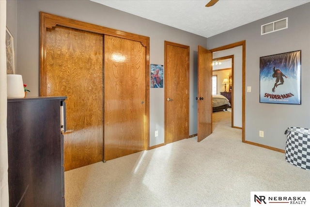 926 Iron Rd, Papillion, NE 68046 - bedroom featuring two closets, baseboards, and a ceiling fan