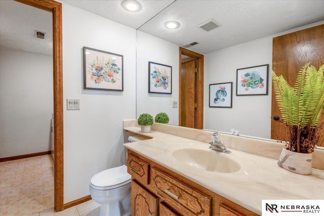 926 Iron Rd, Papillion, NE 68046 - bathroom with vanity, toilet, a textured ceiling, and baseboards