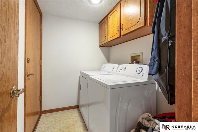 926 Iron Rd, Papillion, NE 68046 - laundry room with washing machine and dryer, cabinet space, and baseboards