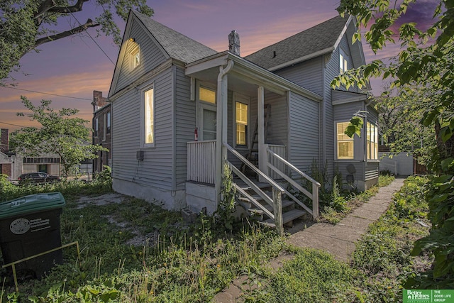 1320 N 40th St, Omaha, NE 68131 - view of front of property with covered porch and roof with shingles