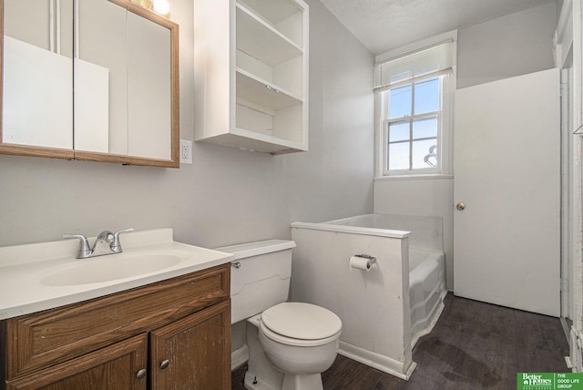 1320 N 40th St, Omaha, NE 68131 - full bathroom with wood finished floors, toilet, a bath, and vanity
