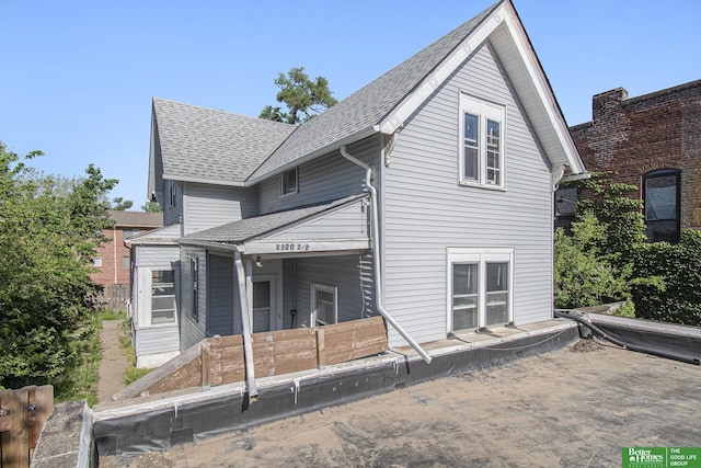 1320 N 40th St, Omaha, NE 68131 - rear view of property with a shingled roof