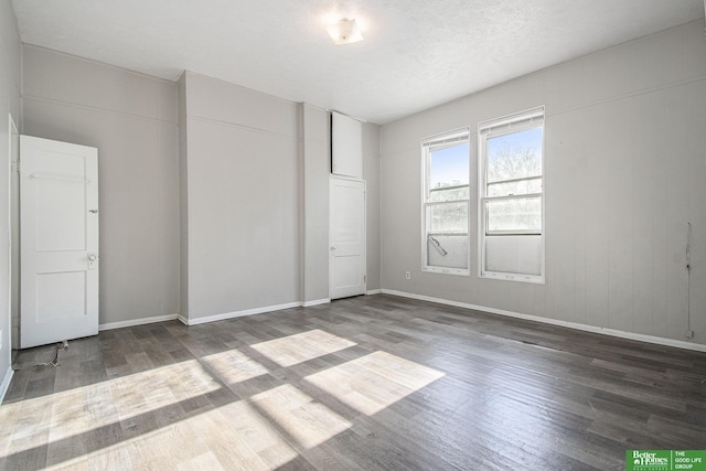 1320 N 40th St, Omaha, NE 68131 - unfurnished bedroom with wood finished floors and baseboards