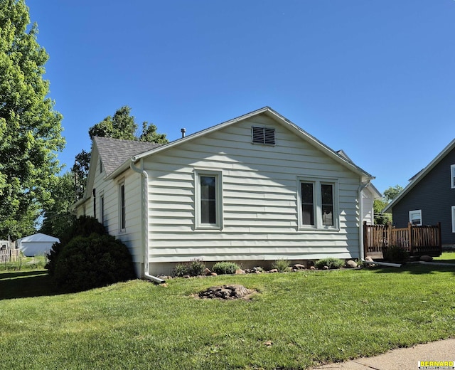 1112 10th St, Auburn, NE 68305 - view of property exterior with a yard and roof with shingles