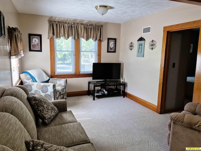 1112 10th St, Auburn, NE 68305 - carpeted living room featuring baseboards