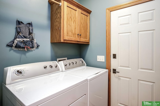 8112 Molokai Dr, Papillion, NE 68046 - laundry area with washing machine and clothes dryer and cabinet space